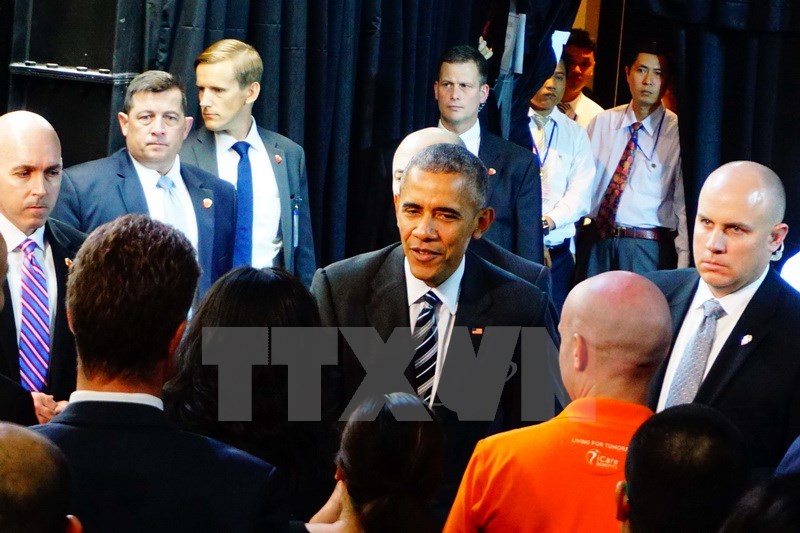 Tổng thống Mỹ Obama tới tòa nhà Miss Áo Dài, đường Nguyễn Trung Ngạn, quận 1, Thành phố Hồ Chí Minh. (Ảnh: Văn Đạt/TTXVN)