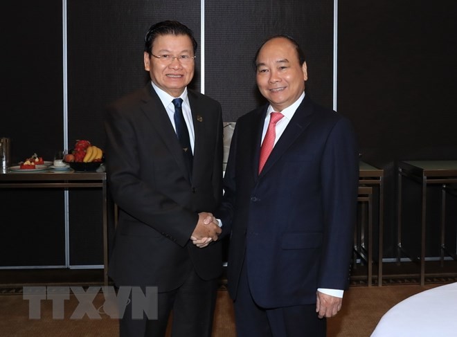 Sáng 17/3/2018, tại Thành phố Sydney, Thủ tướng Nguyễn Xuân Phúc gặp Thủ tướng Lào Thongloun Sisoulith. (Ảnh: Thống Nhất/TTXVN)