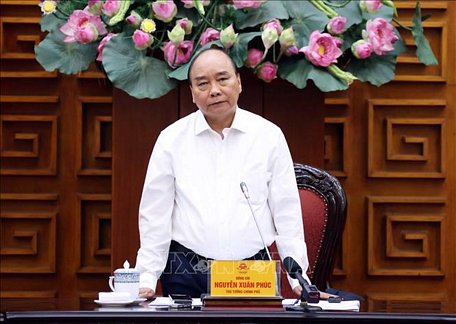  Thủ tướng Nguyễn Xuân Phúc thông báo nhanh về cơn bão số 9 đổ bộ vào miền Trung. Ảnh: Thống Nhất/TTXVN